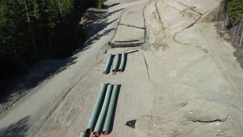 Multiple sections of pipe await joining on a pipeline construction site Stock Footage 163183178