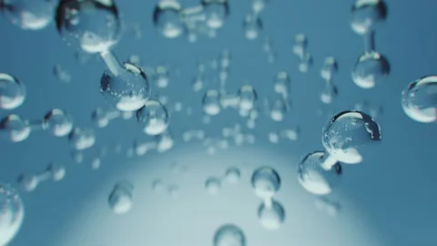 Multiple shiny hydrogen or oxygen gas particles floating slowly in the air Stock Footage 220603332