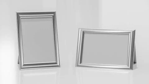 Multiple shiny metal picture frames to add your content on a white glossy Stock Illustration