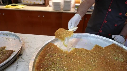 Multiple shots of Arab/Turkish dessert Kunafa, kunafeh in Doha Qatar at Souk Waq 库存影片 222893416