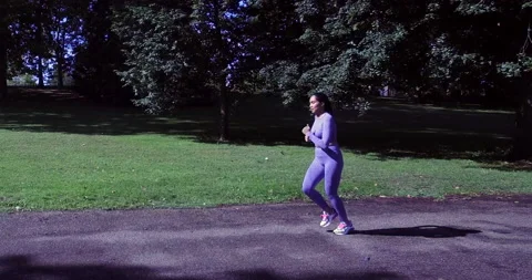 Multiple shots of Young Mixed Race Woman Runner Running Stock Footage 140177650