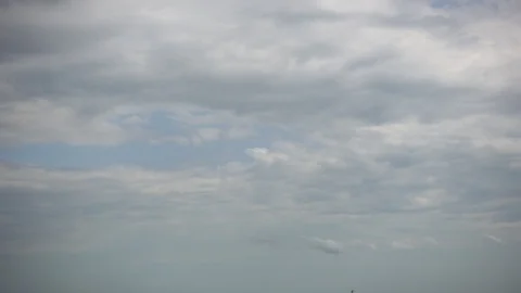 Multiple Silver Cloud Layers Moving Timelapse 003 Stockbeeldmateriaal 93804627