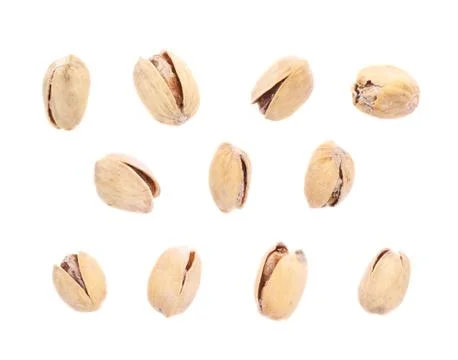 Multiple single pistachios isolated Stock Photos