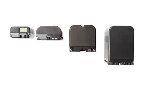 Multiple size and shape camera batteries isolated on white background Stock Photos