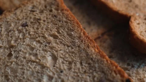 Multiple slices of whole grain bread displayed together in a layered arrangement 库存影片 338297906