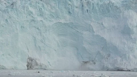 Multiple Small Glacier Calving Events at Eqi Glacier Greenland Stock-Footage 345577496