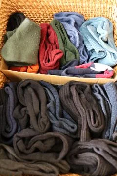Multiple socks folded and stored in a box. Stock Photos