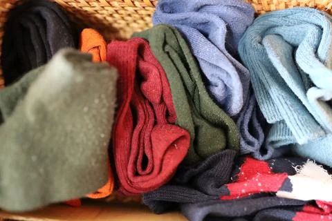 Multiple socks folded and stored in a box. Stock Photos