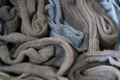 Multiple socks folded and stored in a box. Stock Photos