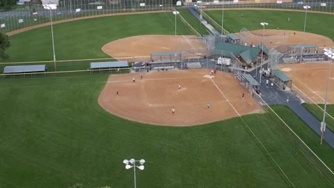Multiple Softball Games At Andrews Park Champlin Minnesota - Rotating Drone Shot Stock Footage 225604071