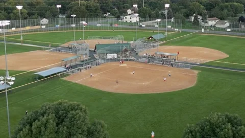 Multiple Softball Games At Andrews Park Champlin Minnesota - Orbiting Drone Shot Stock Footage 225604555