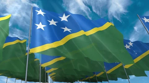 Multiple Solomon Islands flags seamless looping waving on blue sky Stock Footage 343684600