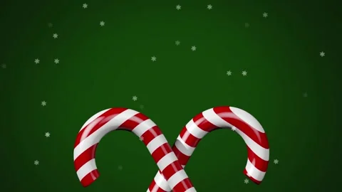 Multiple star icons falling over candy cane icon on green background 库存影片 329412444