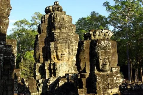 Multiple stone faces on the Bayon Temple in Angkor Stock Photos