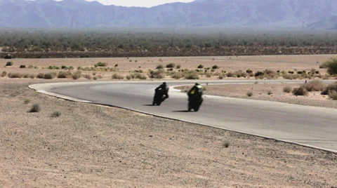 Multiple Superbikes Racing Long shot into turn Stock Footage 34134253