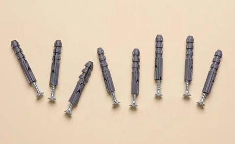 Multiple syringes arranged on a light beige background 写真素材