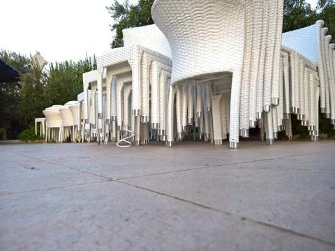 Multiple tacked  chairs  and sun umbrellas Stock Photos