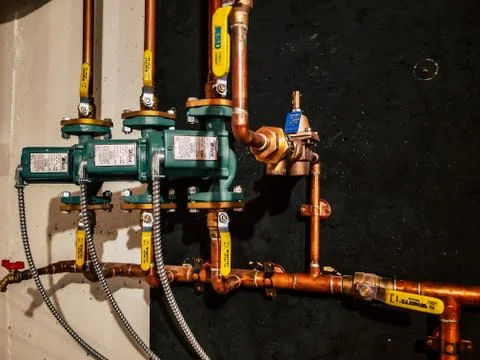 Multiple Taco 007 circulator pumps on a very neat copper piping system Photos