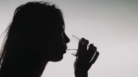 Multiple Takes of a Female Drinking Water on White Background Stock Footage 79751218