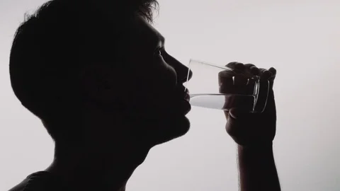 Multiple Takes of a Male Drinking Water on White Background Stock Footage 79751226