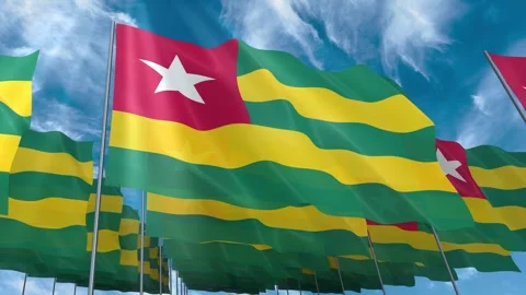 Multiple Togo flags seamless looping waving on blue sky Stock Footage 343685119