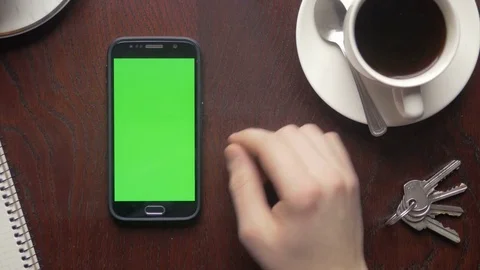 Multiple touch gestures on a phone with green screen for content replacement Stock Footage 75457506