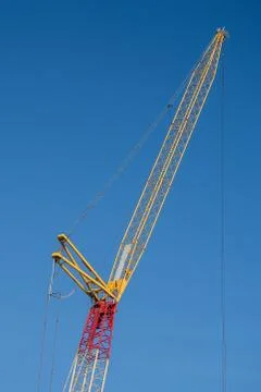 Multiple tower cranes above a concrete structure. Stock Photos