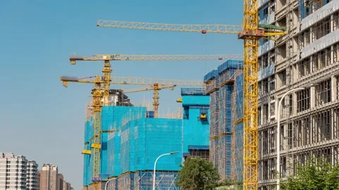 Multiple tower cranes work on construction site to build residential buildings. Stock Footage 336038369