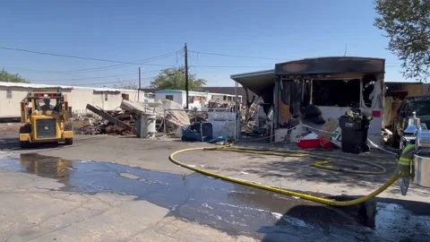 Multiple trailer fire scene with working fire crews Stock Footage 156018420