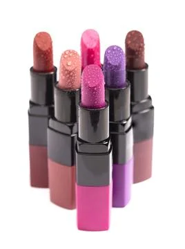 Multiple Tubes of Different Colored Lipsticks Isolated on a White Background Stock Photos