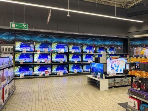Multiple TVs for Sale at Large Electronics Supermarket in France Stock Photos