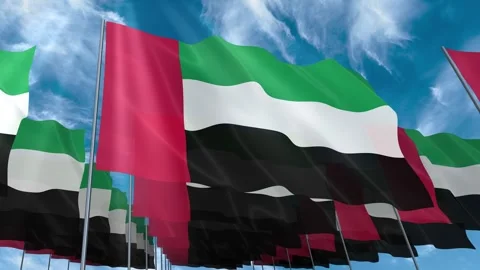 Multiple United Arab Emirates flags seamless looping waving on blue sky Stock Footage 343685372