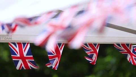 Multiple United Kingdom flags are blown by the wind during garden party 스톡 동영상 278232317