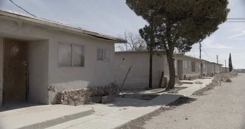 Multiple Units of Abandoned Motel in the Desert - Pan Left Stock Footage 89942914