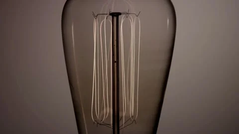 Multiple vertical bulb filaments glow bright then fade out Stock Footage 329657295