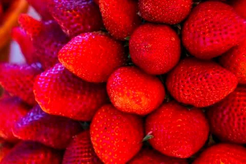 Multiple views of a pile of strawberries Stock Photos