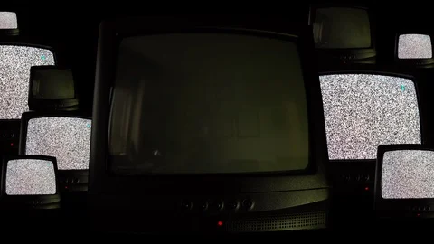 Multiple vintage televisions on black background, repeating pattern of many Stock-Footage 127870195