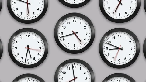 Multiple wall clocks in white background. Stock Footage 124770699