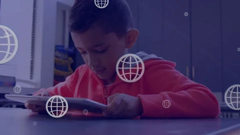 Multiple web globe icons floating over boy using digital tablet in the class at Stock Footage 326302663