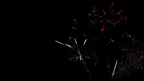 Multiple white and golden fireworks illuminating the dark sky Stock Footage 329675985