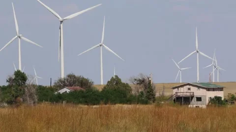 Multiple Wind Turbines in Background of Residential Farm House Stock Footage 54801250