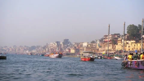 Multiple wooden in the river Ganges carrying tourists and devotees Stock Footage 320454236