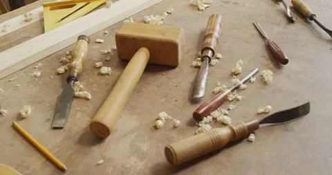 Multiple woodworking tools on wooden workshop table in a carpentry shop Stock Footage 339320037