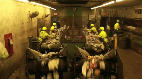 Multiple Workers Sort Trash on Conveyer Belt 動画素材 594354