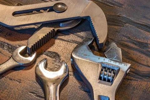 Multiple wrenches on wood Stock Photos