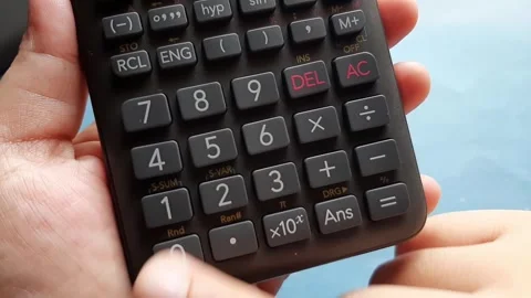 Multiplying a number by zero on a calculator	 Stock Footage 285911580