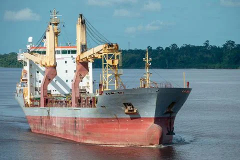 Multipurpose cargo ship underway in the river. Stock Photos