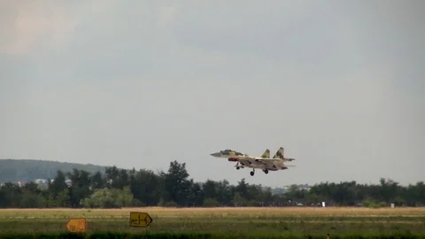 Multipurpose fighter Su-35 (NATO name: Flanker-E) makes  right turn and lands. Video stock 118959629