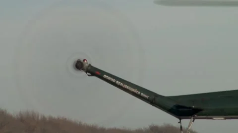Multipurpose helicopter Mi-2 (NATO: Hoplite) stands on concrete runway. Stock Footage 139397846