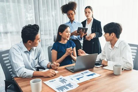 Multiracial analyst team use BI dashboard for data analysis with laptop. Concord Stock Photos